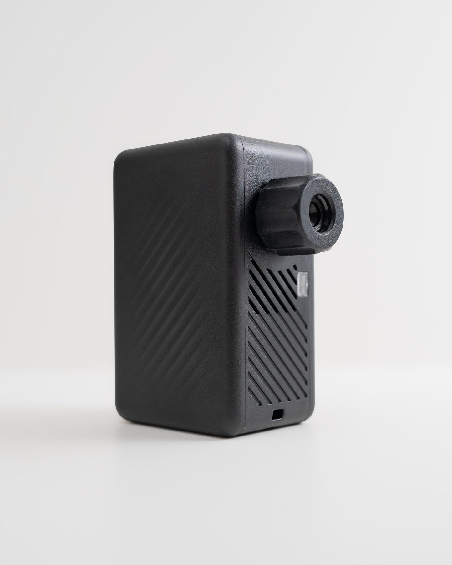 Rear angled view of the AYR Cycling E-Pump showing textured housing and USB-C charging port